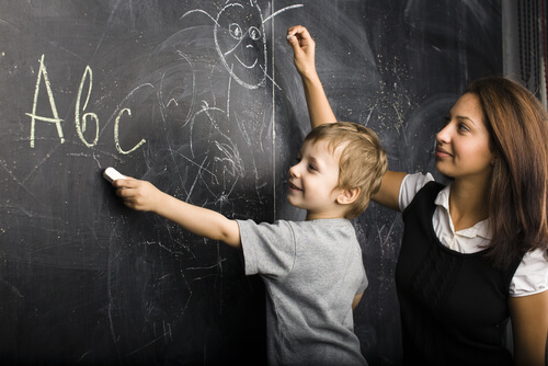 teacher and student at blackboard