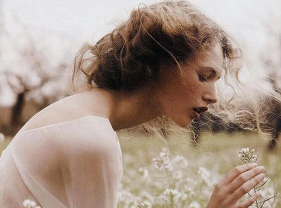 woman amongst white flowers