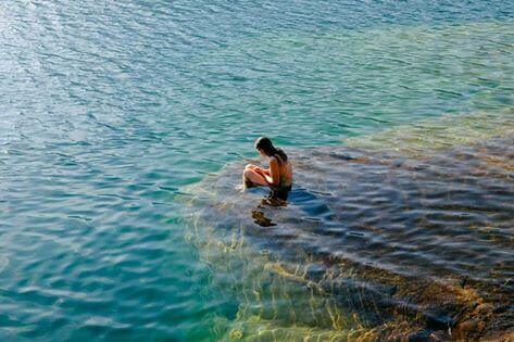 woman bathing in the sea alone