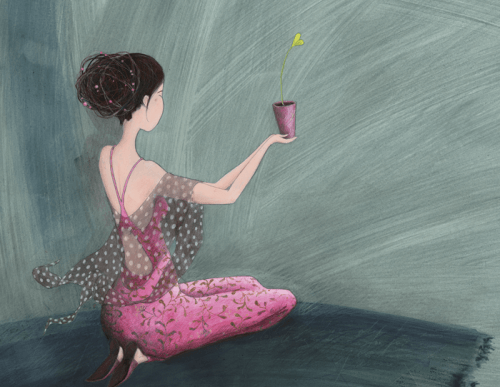 woman holding a plant