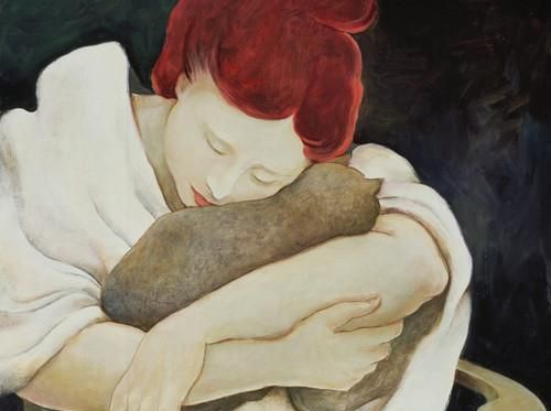 woman hugging a cat