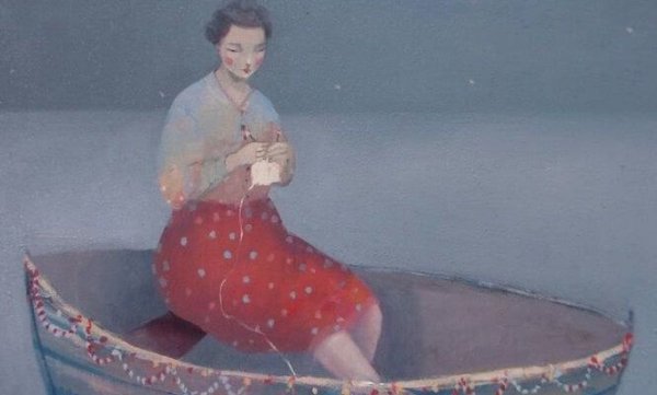 woman knitting on a boat