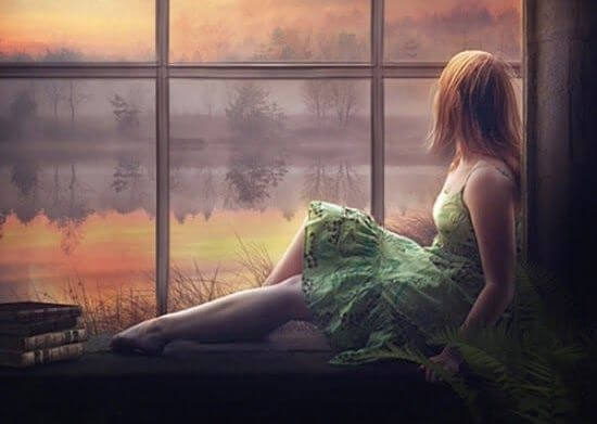 woman looking out the window