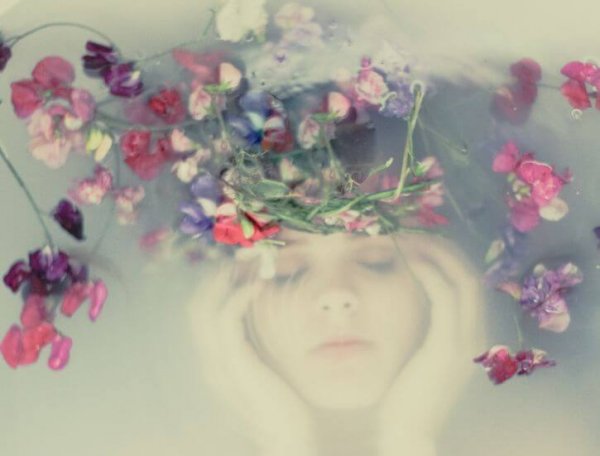 woman under flowers