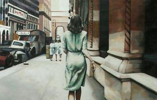 woman with her back turned in a green dress
