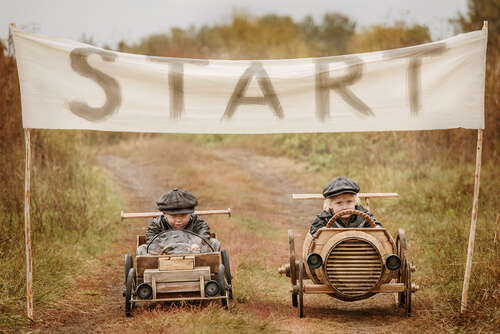 boys competing in a car race