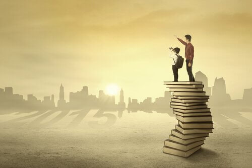 father boy on top of books