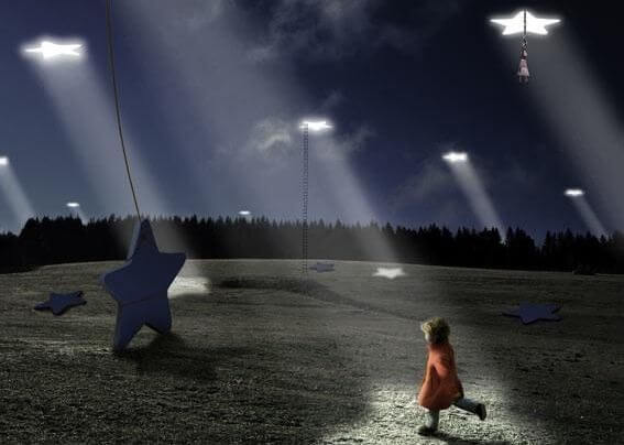 girl walking towards giant stars