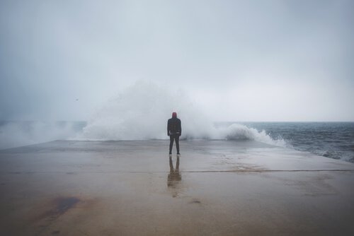 man in front of sea feeling fear