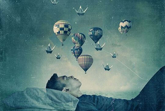 man watching balloons