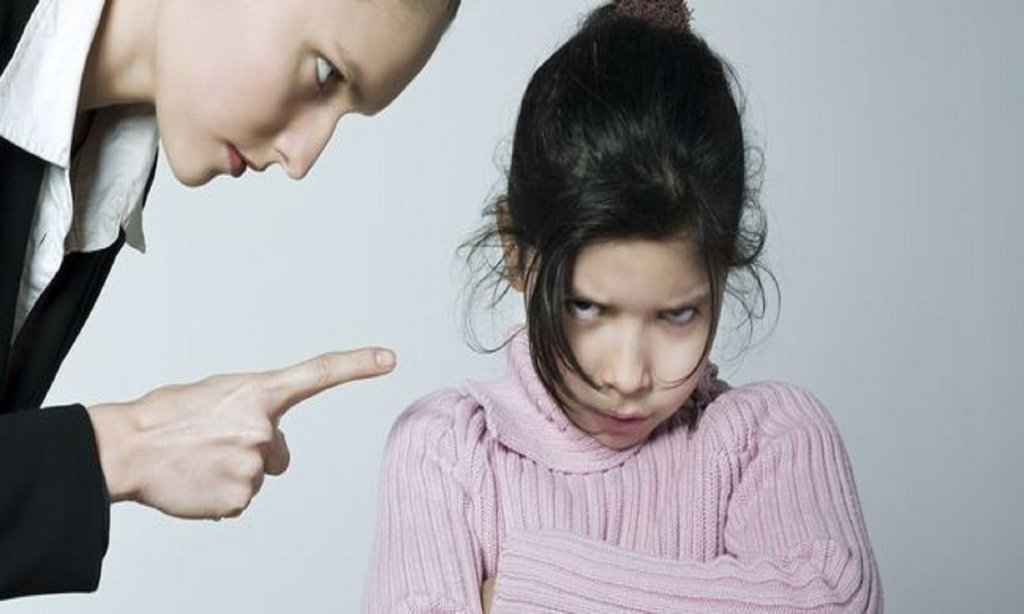 mother scolding angry girl