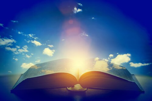 open book with a light in the middle