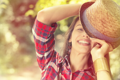 smiling woman with her a hat on her head