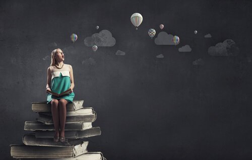 woman sitting reading a book and imagining