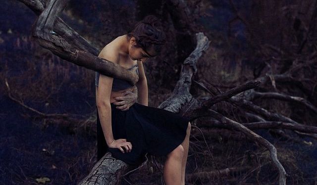 woman trapped by a tree
