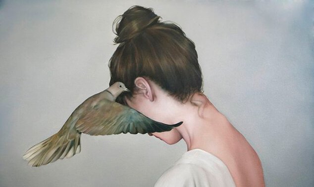 woman with wood pidgeon in her ear