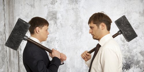 Men With Hammers Facing Each Other