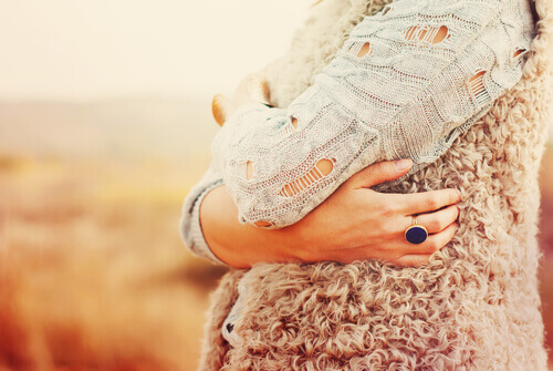 Woman Hugging Self