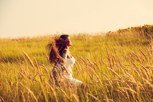 Woman Walking through Field