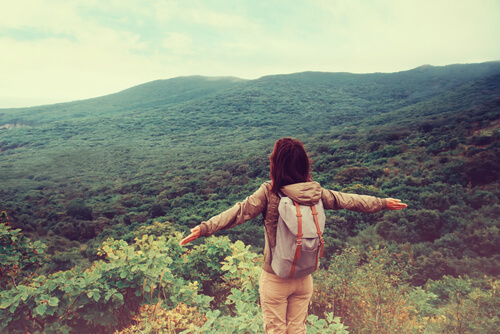 Woman Backpacking in Mountains