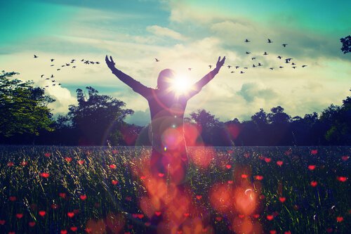 Woman witih Arms Up in Flower Field