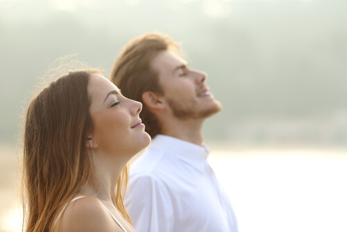 Man and Woman Breathing Deeply