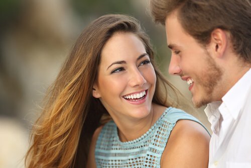 A man and a woman making eye contact.