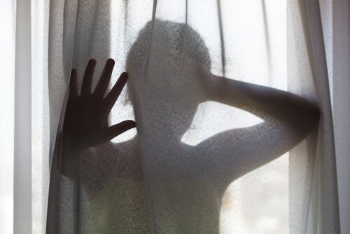 girl behind a curtain