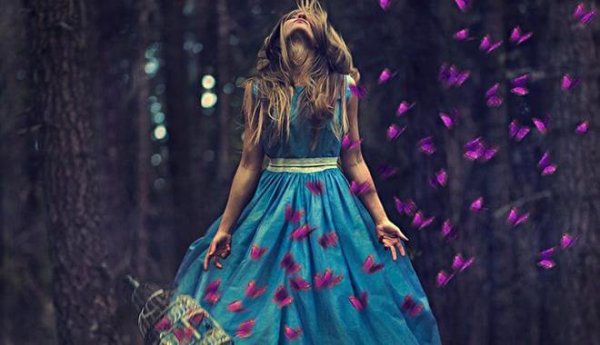 girl surrounded by purple butterflies