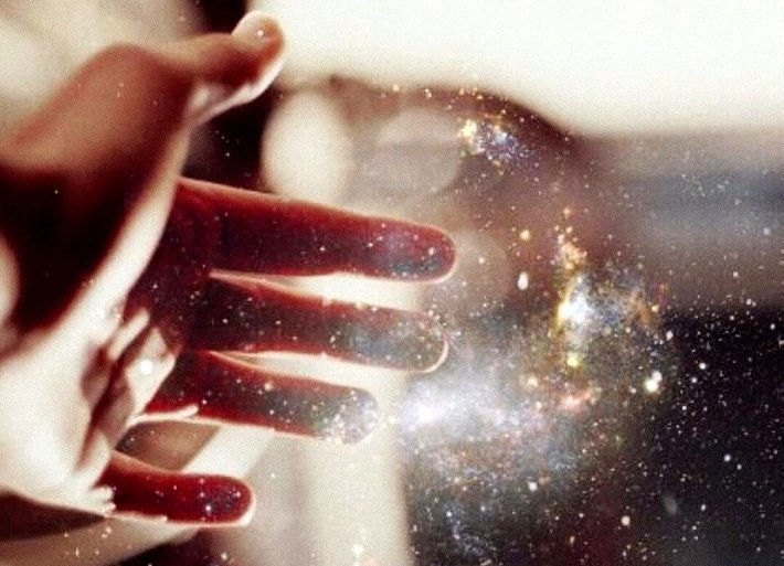 hand touching a beam of light