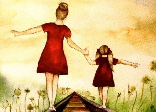 mother and daughter on railroad tracks