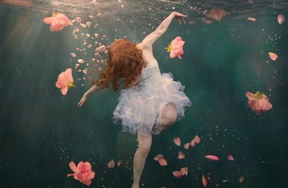Woman in Water with Roses