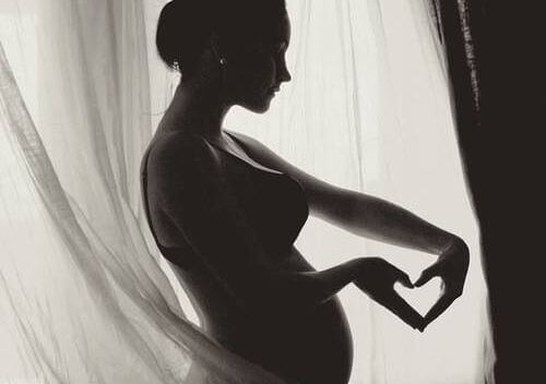Pregnant Woman Heart with Hands