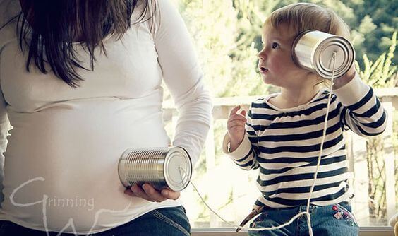 Child Listening to Mother's Belly