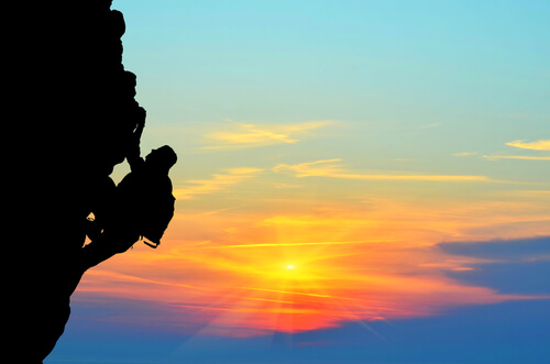 Man Climbing Mountain