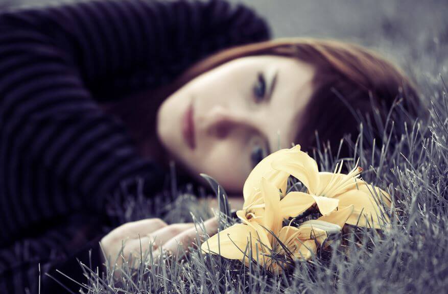 Sad Woman on Ground Yellow Flower