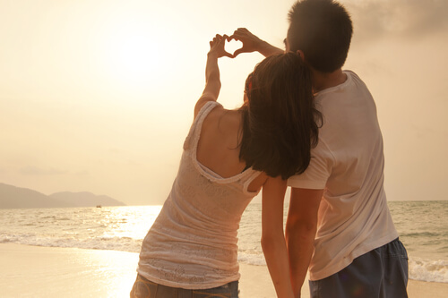 Couple Making Heart with Hands