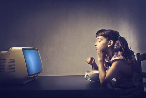 child in front of screen