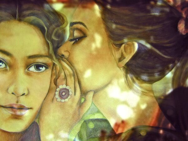 Woman Whispering in Other's Ear