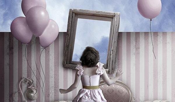 girl looking into mirror