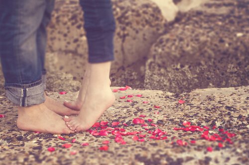 girl standing on guys feet