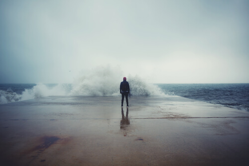 man in front of a wave