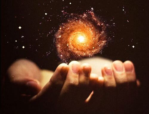 Hands Holding Galaxy
