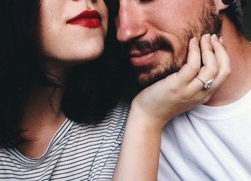 Woman Rubbing Man's Face