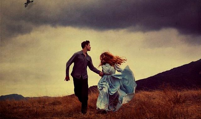 Man and Woman in Blue Dress Running