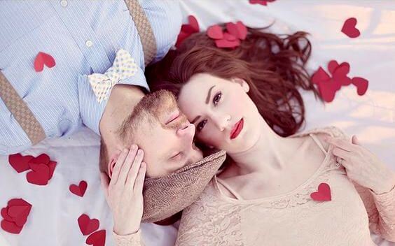 Couple Surrounded by Hearts