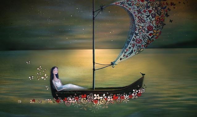 woman on a boat with flowers navigating