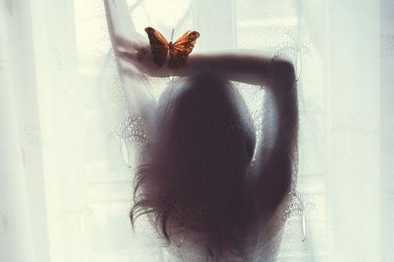 woman silhouette with butterfly