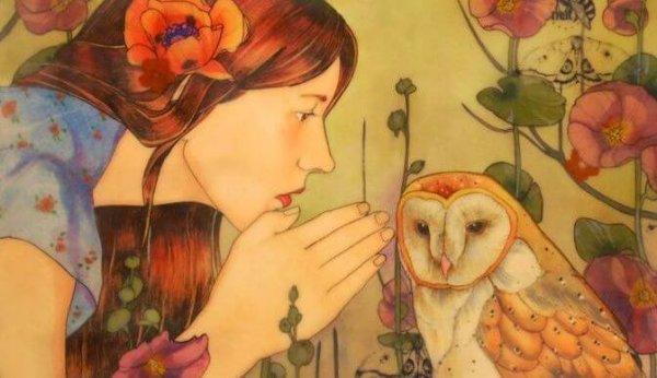 woman whispering to an owl