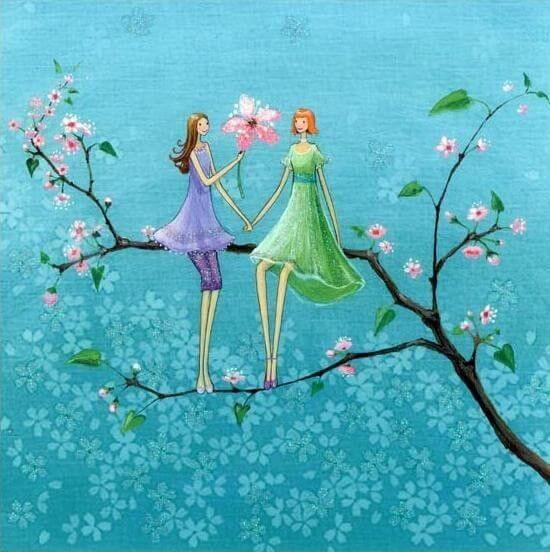 women sitting on a branch